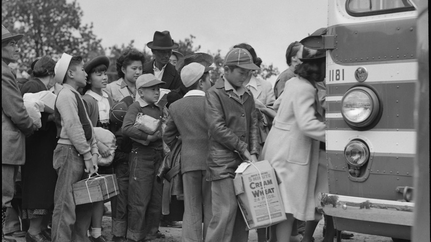 This photo, taken on May 9, 1942, in Centerville, California, shows Japanese-Americans boarding an evacuation bus. People of Japanese ancestry were sent to be housed in War Relocation Authority centers for the duration of World War II.