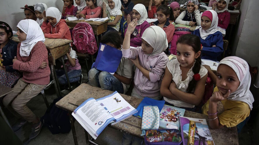 Syrian children attend a class in one of the underground rooms of the Al-Hayat school in Damascus' al-Qaboun surburb on October 19, 2016. After the Al-Hayat school was targeted in government air strikes on November 5, 2014, resulting in the death of more than a dozen students, the school moved to an underground location. Photo by: AFP/Sameer Al-Doumy/Getty Images