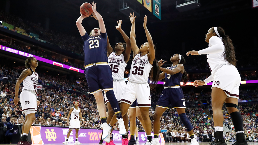 A group of people on a court.