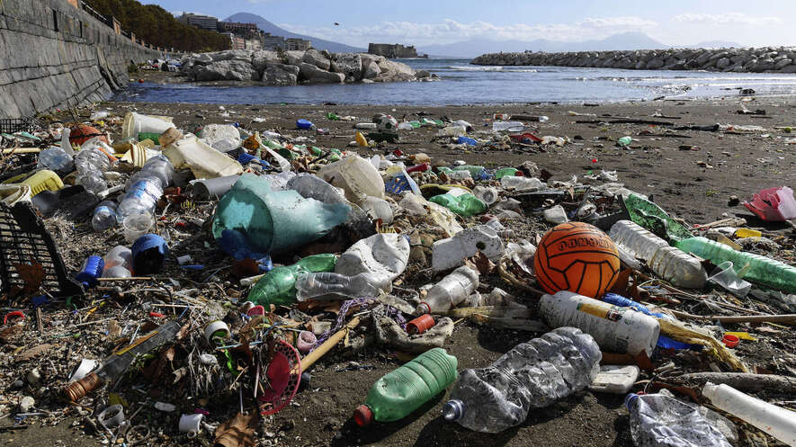 A beach in Naples, Italy, is covered with plastic waste and debris. What can you do to fight plastic pollution in 2019? Photo by Salvatore Laporta/Getty Images