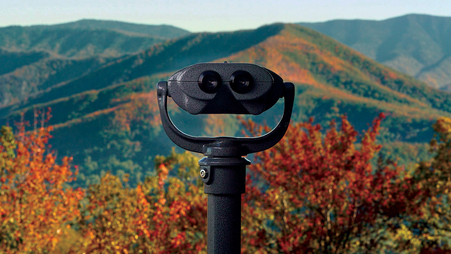 A viewfinder looks out over hills.